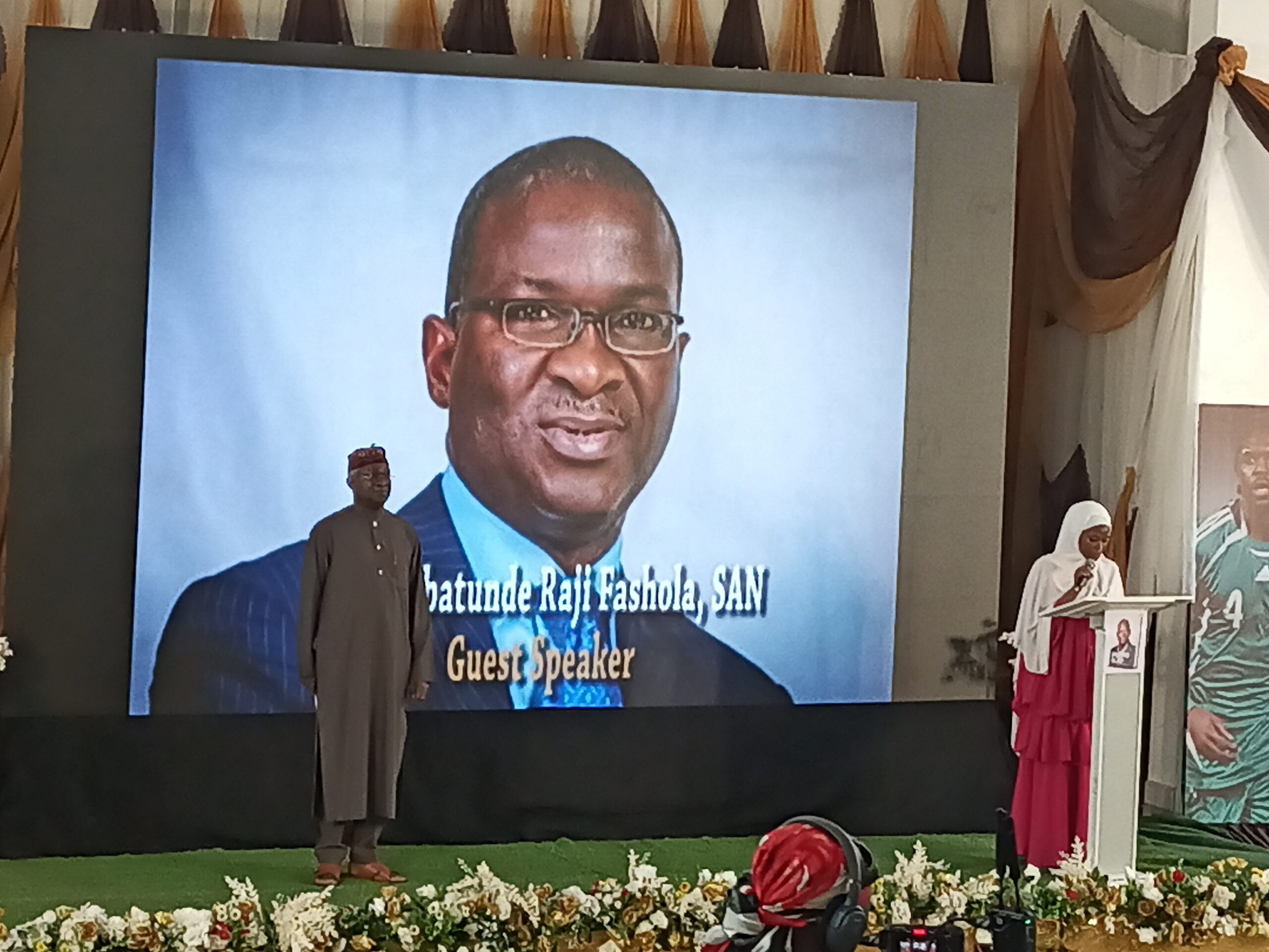 Babatunde Raji Fashola on the podium during his citation reading before delivering his keynote address during Dr. Mumini Alao's Autobiography launch in Lagos