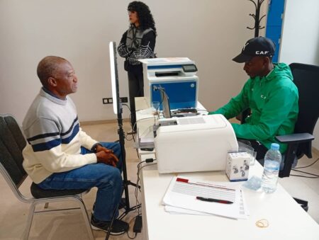 AFCON 2025 Diary, Day 3: Morocco’s Arab Cup Glory, Eagles’ Camp In Fez And CAF’s Historic Decision Mumini Alao (left) undergoes the formalities for procuring AFCON 2025 Media Accreditation Tag in Fez