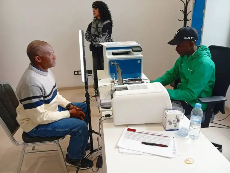 Mumini Alao (left) undergoes the formalities for procuring AFCON 2025 Media Accreditation Tag in Fez