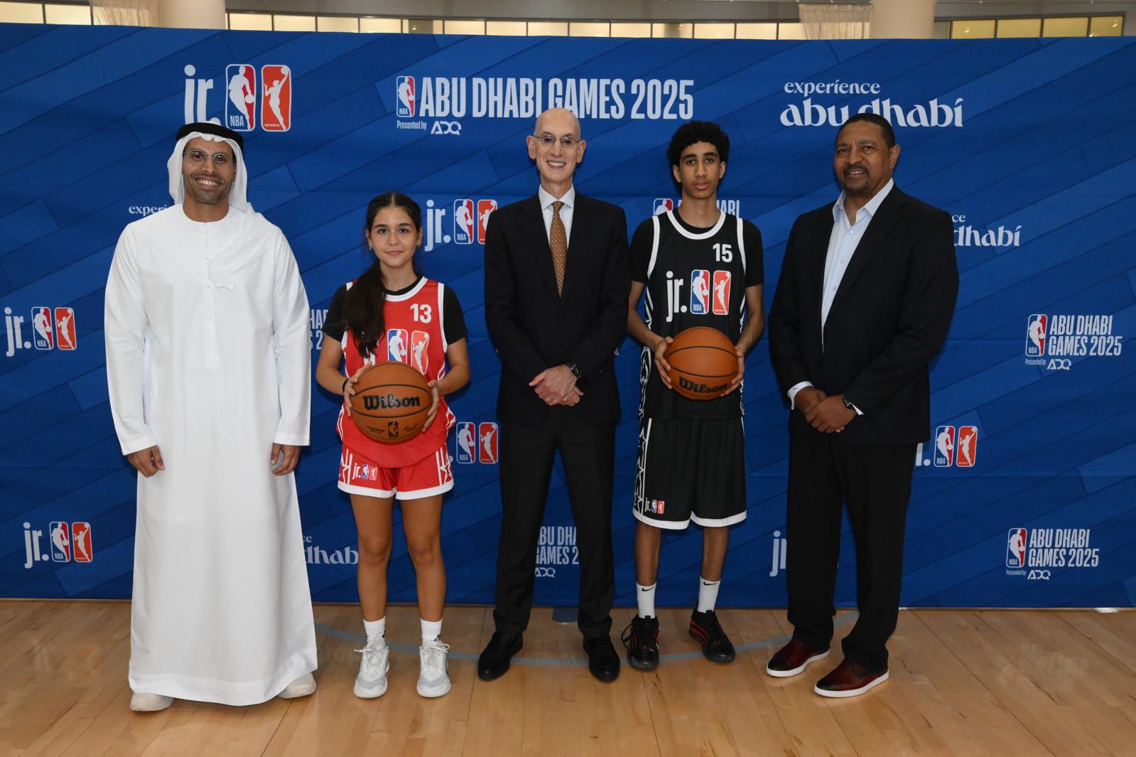 (Left to right) HE Mohamed Khalifa Al Mubarak, Chairman of DCT Abu Dhabi, NBA Commissioner Adam Silver and NBA Legend Mark Jackson alongside local participants at a youth basketball development event in Abu Dhabi as part of the largest Jr. NBA/Jr. WNBA week to date (Credit: NBAE/Getty Images)