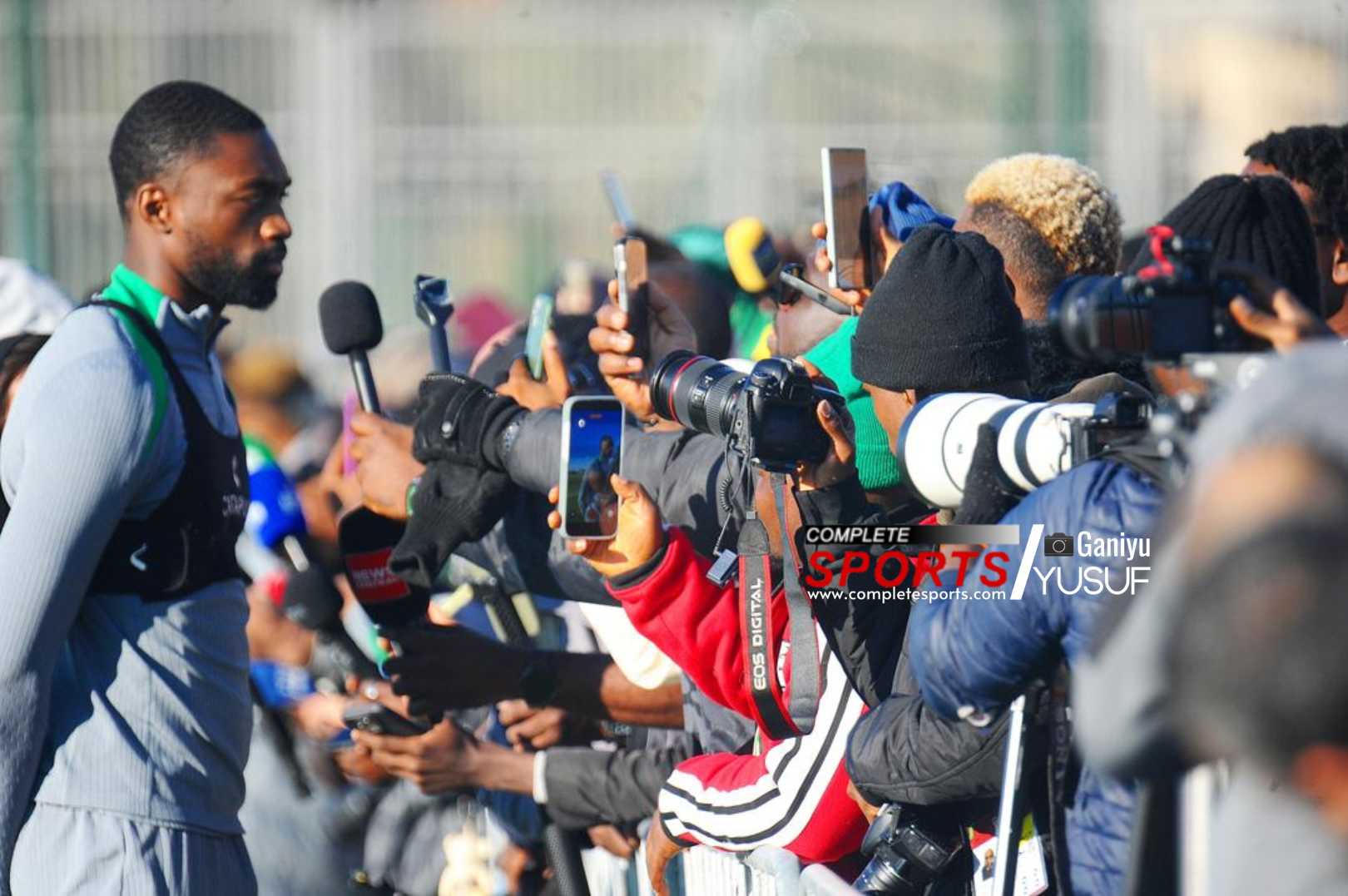 Super Eagles center back, Semi Ajayi, granting interviews to a horde of Nigerian journalists at their training ground in Marrakech.