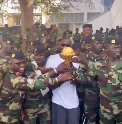 Senegal Head Coach Takes AFCON Trophy To Military Base