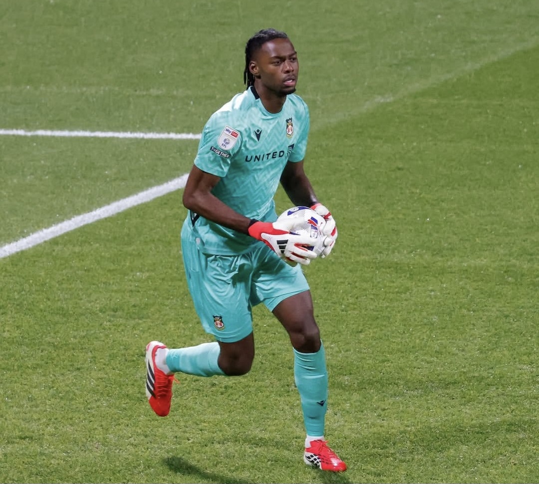Arthur Okonkwo in action for Wrexham during a league match