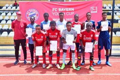 Pflugler and his FC Bayern colleague, Christopher Loch, flank their Nigerian partners in Awka.